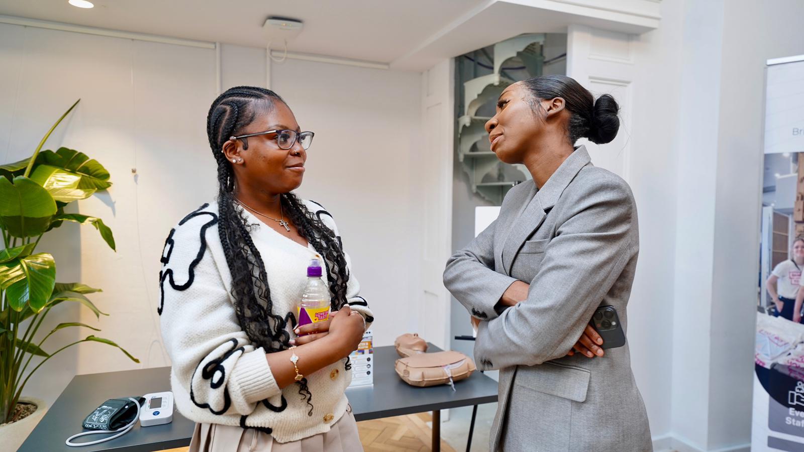 Two attendees in conversation